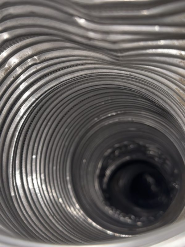Inside a clean flexible dryer duct after cleaning